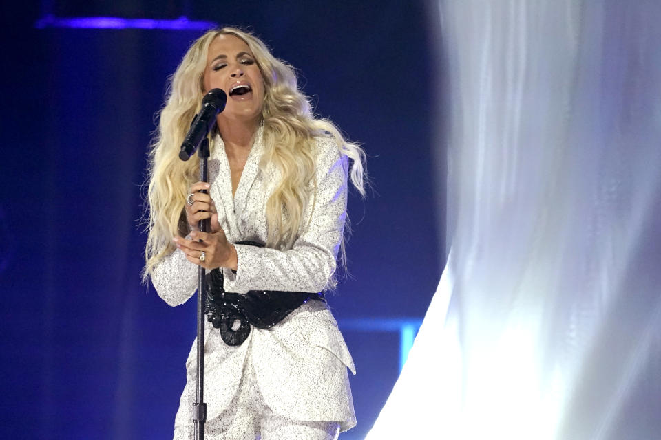 Carrie Underwood performs "I Wanna Remember" with NEEDTOBREATHE at the CMT Music Awards on Wednesday, May 5, 2021, in Nashville, Tenn. The awards show airs on June 9 with both live and prerecorded segments. (AP Photo/Mark Humphrey)