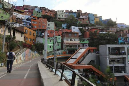 A man walks in the "Comuna 13" neighborhood in Medellin September 2, 2015. Picture taken September 2, 2015. REUTERS/Fredy Builes
