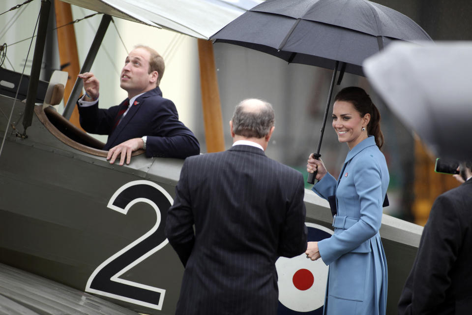 Britain's Prince William, left, sits in a classic Sopwith Pup as he and his wife Kate, the Duchess of Cambridge, tour the Omaka Aviation Heritage Centre in Blenheim, New Zealand, Thursday, April 10, 2014. (AP Photo/Tim Cuff, Pool)