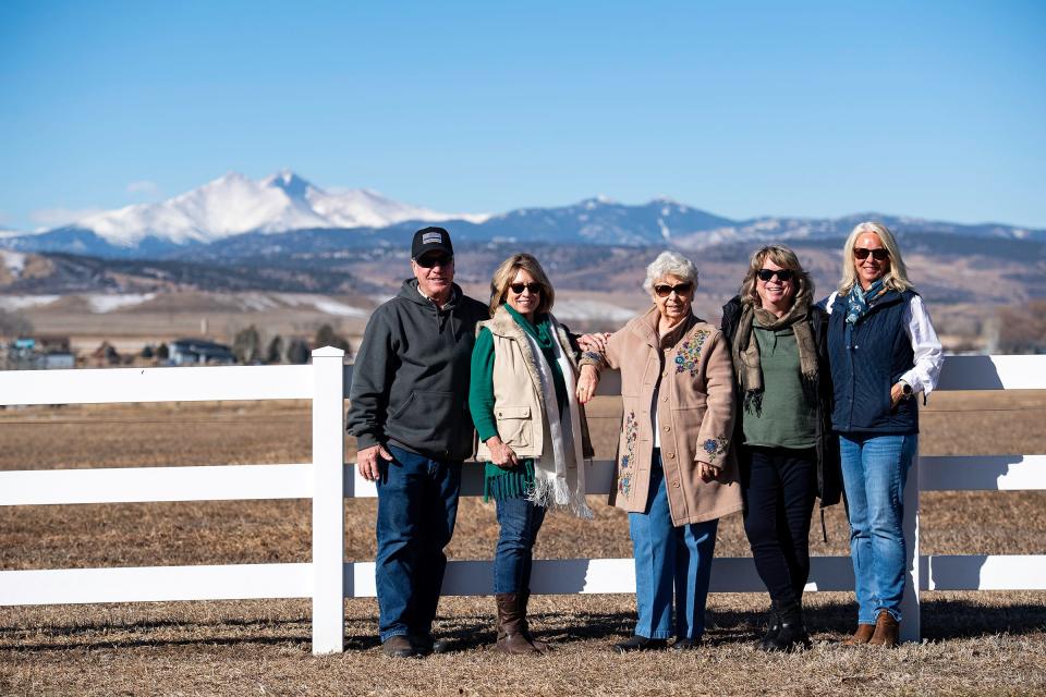 Carol Yoakum, 91, and her family pose for a picture at her former Longmont farm on Tuesday. On Wednesday, the last links to the property — 90 shares of Colorado-Big Thompson water — were auctioned at Boulder County Fairgrounds in Longmont.