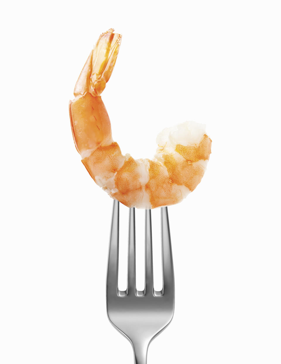 shrimp with tail impaled on a fork