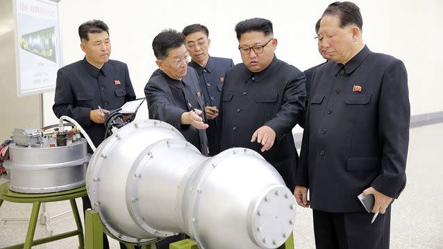 Kim Jong-Un looks at a nuclear weapon in 2017. Source: AAP