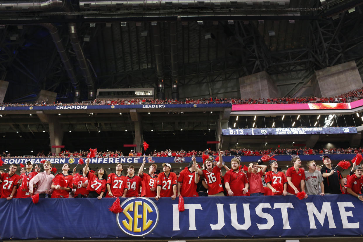 Georgia fans celebrate in the second half of the team’s NCAA college football game against Auburn for the Southeastern Conference championship, Saturday, Dec. 2, 2017, in Atlanta. (Joshua L. Jones/Athens Banner-Herald via AP)