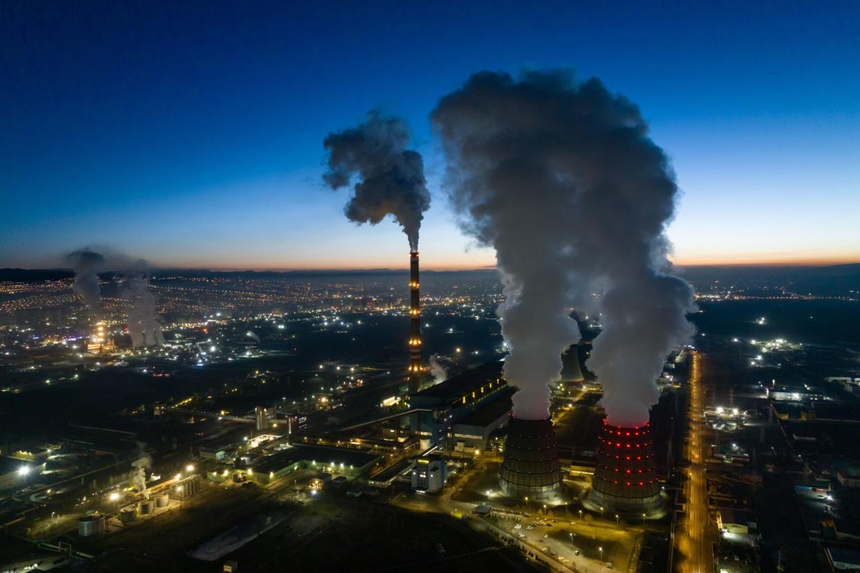 Smoke and water vapor from the Ulaanbaatar Thermal Power Plant No. 4 combined heating and power plant at dawn in Ulaanbaatar, Mongolia, early on Sunday, March 12, 2023. Photographer: SeongJoon Cho/Bloomberg