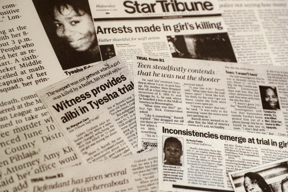 This Oct. 24, 2019, photo shows a collection of newspaper clippings on the progress of the murder trail against Myon Burrell in the stray-bullet killing of Tyesha Edwards in Minneapolis. Sentenced to life after a young black girl was killed by a stray bullet, Burrell's story has been told - and told again - by U.S. Sen. Amy Klobuchar while trumpeting her tough-on-crime record as a top Minneapolis prosecutor. But a year-long Associated Press investigation discovered major flaws and inconsistencies in the case, raising questions about whether the 16-year-old alleged shooter may have been wrongly convicted. (AP Photo/John Minchillo)