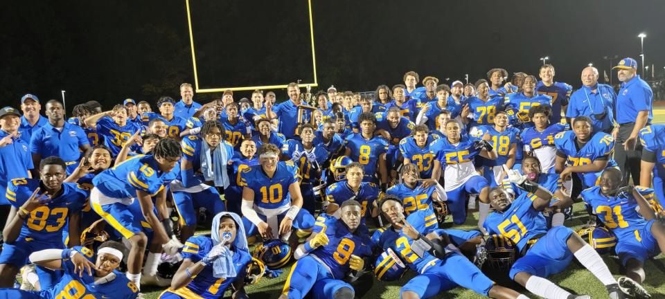 The North Brunswick football team celebrates after beating rival South Brunswick on Sept. 2, 2021