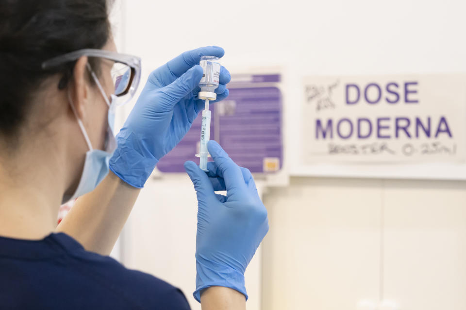 A Moderna booster coronavirus vaccine dose is drawn into a syringe at a Covid vaccination centre at Elland Road in Leeds, as the booster vaccination programme continues across the UK. Picture date: Tuesday December 21, 2021. (Photo by Danny Lawson/PA Images via Getty Images)