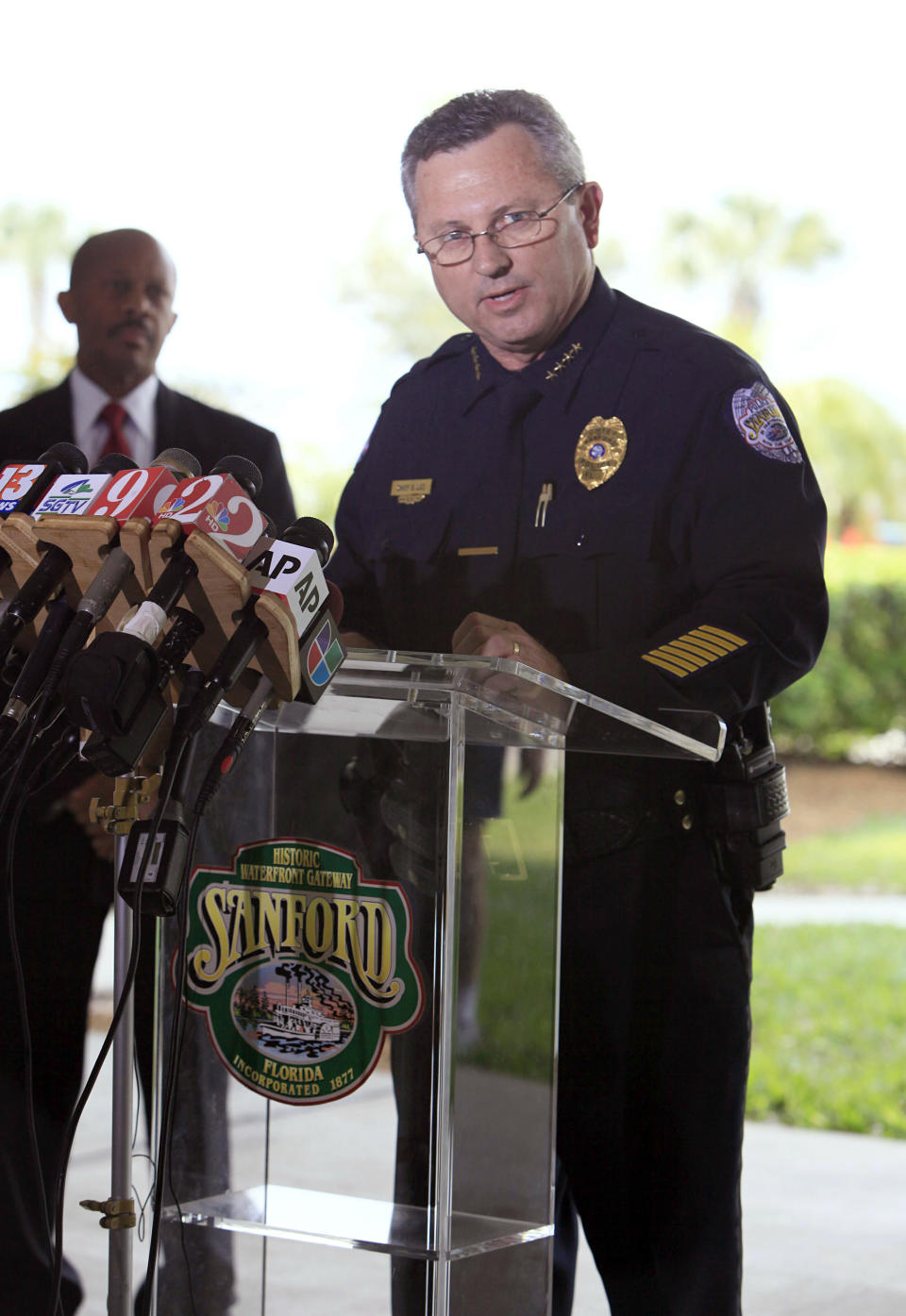 <strong>March 22, 2012</strong> -- Sanford Police Chief Bill Lee holds a press conference and announces he is temporarily stepping down as police chief because his presence is a "distraction."  State Attorney Norm Wolfinger recuses himself from the case and Florida Gov. Rick Scott announces that another state attorney, Jacksonville-based Angela Corey, will be replacing Wolfinger as special prosecutor in the investigation.  Meanwhile, Rev. Al Sharpton, Martin Luther King III and other civil rights leaders and politicians hold a justice rally at Sanford's Fort Mellon Park. They demand an arrest in Martin's shooting. An estimated 10,000 people attend the event.