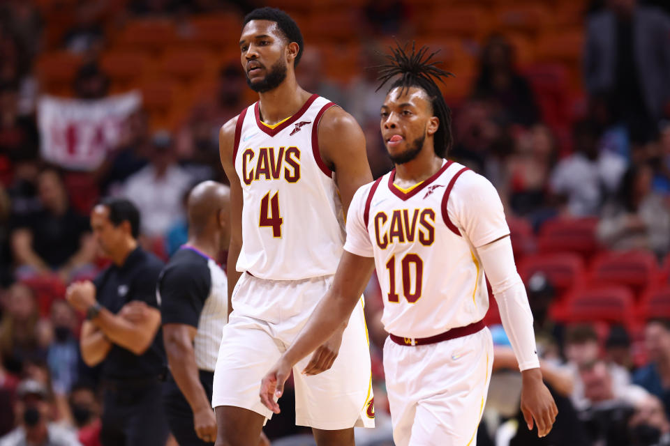 Evan Mobley #4 and Darius Garland #10 of the Cleveland Cavaliers look on against the Miami Heat during the first half at FTX Arena on March 11, 2022 in Miami, Florida. NOTE TO USER: User expressly acknowledges and agrees that, by downloading and or using this photograph, User is consenting to the terms and conditions of the Getty Images License Agreement. (Photo by Michael Reaves/Getty Images)