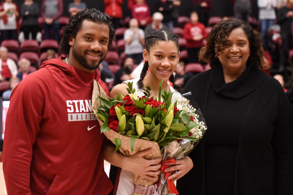 Seattle Seahawks quarterback Russell Wilson joins his younger sister Anna Wilson #3 of the Stanford Cardinal to celebrate Senior Day with mother Tammy Wilson on February 9, 2020, in Palo Alto, California.&nbsp; (Photo: Cody Glenn via Getty Images)