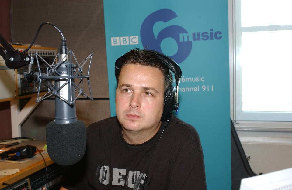 DJ Gideon Coe in the radio studio. Ash, whose NME Brat award-winning single 'Burn Baby Burn' launched 6 Music in March, dropped by the station this morning to perform live on the Mid-Morning Show with Gideon Coe. TX: BBC 6 Music Wednesday 28th August 2002 @ 11.30am (Photo by Jeff Overs/BBC News & Current Affairs via Getty Images)