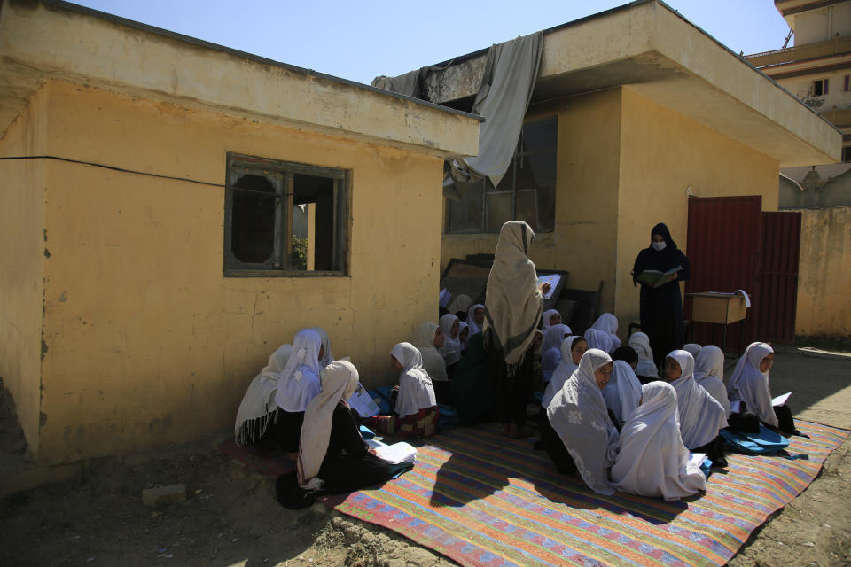 FILE - in this Wednesday, Oct. 7, 2020, students attend an open air class at a primary school in Kabul, Afghanistan, An Afghan education ministry memo banning girls, 12 years old and older, from singing at public school functions, which the education ministry tells The Associated Press was a mistake, is causing a social media stir. (AP Photo/Mariam Zuhaib, File)