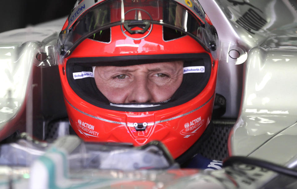 FILE - In this Nov. 23, 2012 file photo, Grand Prix driver Michael Schumacher, of Germany, sits in his car during a free practice at the Interlagos race track in Sao Paulo, Brazil. Michael Schumacher's manager said Friday April 4, 2014 that the retired Formula One star now "shows moments of consciousness and awakening," more than three months after suffering serious head injuries in a skiing accident. Manager Sabine Kehm said in a statement that "Michael is making progress on his way." She added that "we keep remaining confident." (AP Photo/Victor Caivano, File)