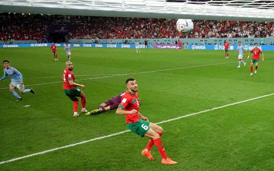 Morocco's Yassine Bounou saves a shot from Spain's Gavi onto the bar - REUTERS