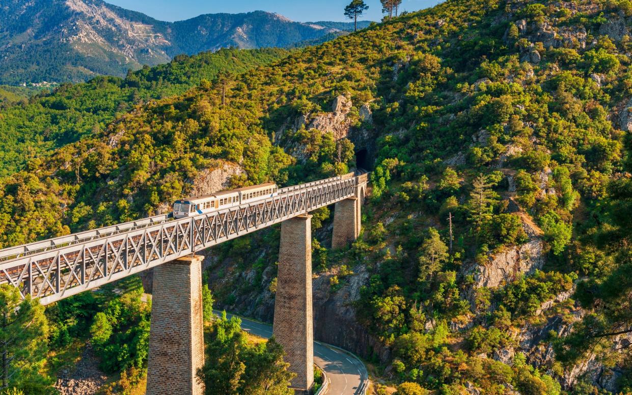 Train crossing Gustave Eiffel's Viaduct in Vecchio, Corsica, France