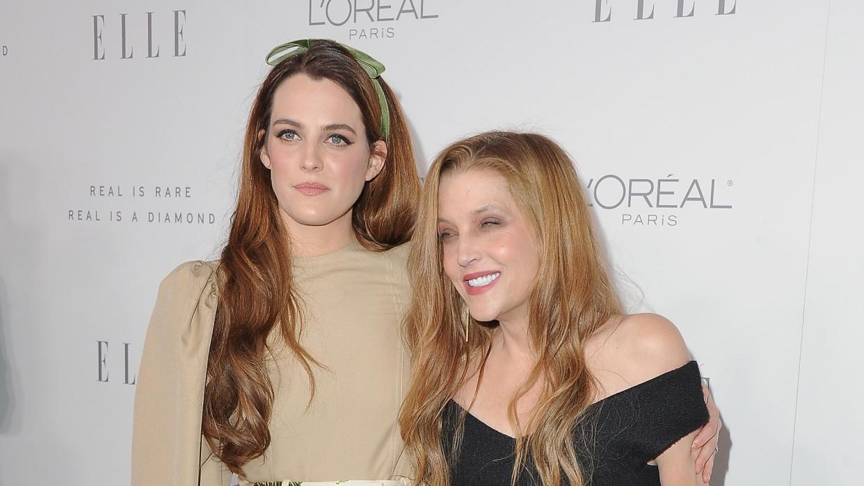 lisa marie presley smiling as she embraces daughter riley keough for a photo