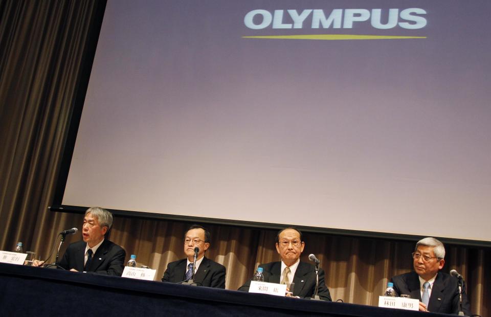 Nearly-appointed President of Olympus Corp. Hiroyuki Sasa, left, speaks as his predecessor Shuichi Takayama, second left, and two outside directors of the company, Hiroshi Kuruma, second right, and Yasuo Hayashida, attend a press conference in Tokyo Monday, Feb. 27, 2012. The entire board of scandal-tainted Olympus is resigning, and a new president and chairman were tapped Monday to lead a turnaround at the Japanese medical equipment maker. The changes will become final at the April 20 shareholders' meeting. (AP Photo/Koji Sasahara)