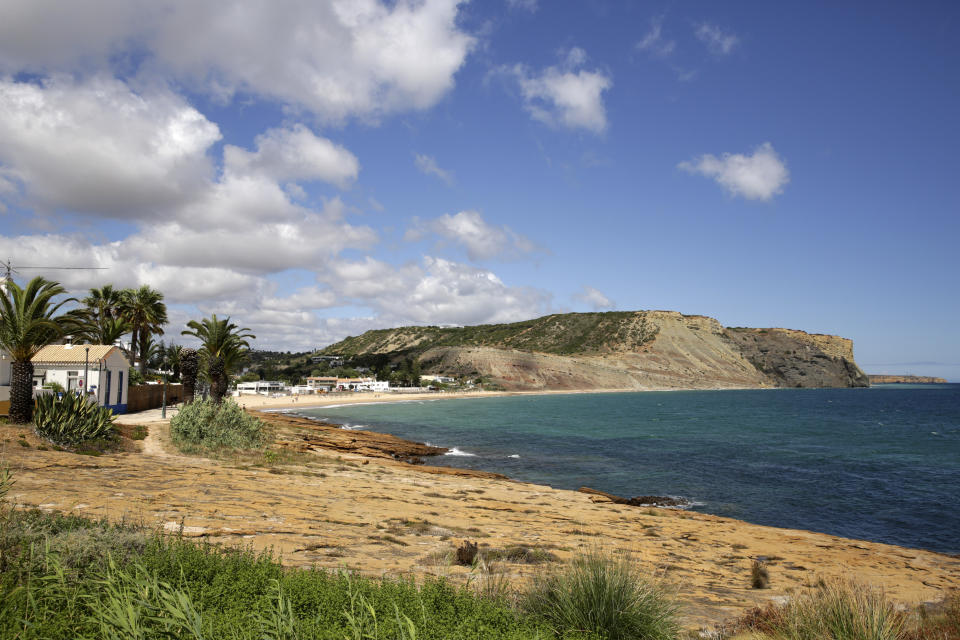 A view of the coastline in Praia da Luz, in Portugal's Algarve coast, Thursday, June 4, 2020. German police have identified a 43-year-old imprisoned German citizen as a suspect in the 2007 disappearance in Praia da Luz of British girl Madeleine McCann. (AP Photo/Armando Franca)