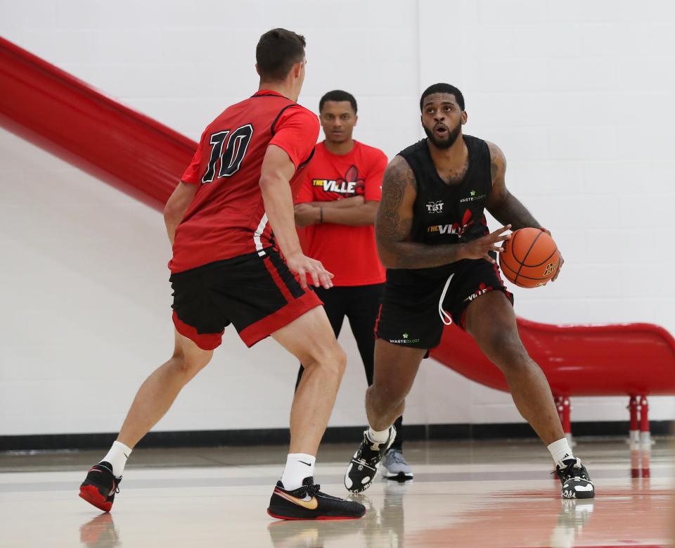 Former U of L basketball player Chane Behanan, right, looks to pass during The Ville's  July 18, 2023 practice at the Kueber Center in Louisville, Ky.