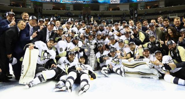 Jim Rutherford’s Penguins pose with the Stanley Cup. (Bruce Bennett/Getty Images/AP)