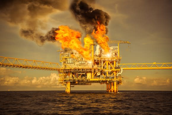 An offshore oil platform on fire.