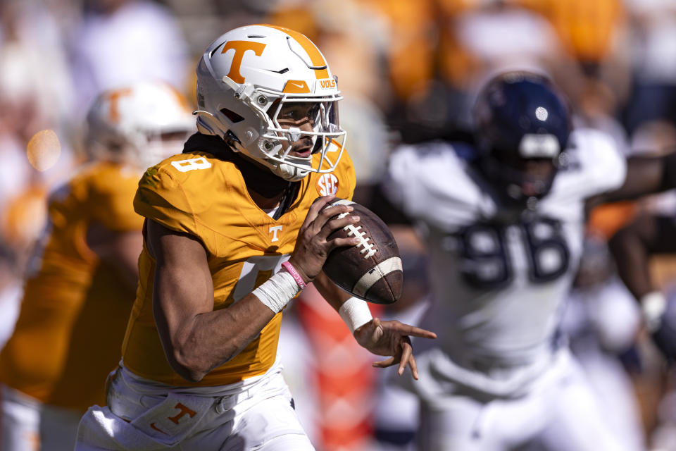 Tennessee quarterback Nico Iamaleava (8) looks for a receiver during the second half of an NCAA college football game against UConn, Saturday, Nov. 4, 2023, in Knoxville, Tenn. (AP Photo/Wade Payne)