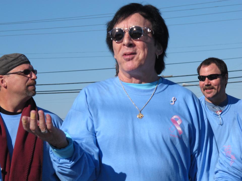 FILE- In this Oct. 21, 2012 file photo, original Kiss drummer Peter Criss walks in a walkathon to raise money for breast cancer research in Point Pleasant Beach N.J. But the band said on Sunday, Feb. 23, 2014 it has decided not to perform at the April 10, 2014 induction ceremony after a dispute over which lineup would play. The dispute concerns whether original members Ace Frehley and Criss would join Gene Simmons and Paul Stanley in a live performance, or whether the current lineup of Stanley, Simmons, Eric Singer and Tommy Thayer would play. (AP Photo/Wayne Parry, File)
