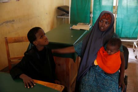 Deko Ibrahim Abdille and her daughter Fatuma visit a health clinic at the Kakuma refugee camp in northern Kenya, March 5, 2018. REUTERS/Baz Ratner