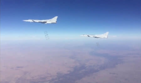 A still image taken from a video footage and released by Russia's Defence Ministry on January 24, 2017, shows Russian Tupolev Tu-22M3 long-range bombers dropping off bombs on what Defence Ministry said Islamic State targets in Deir al-Zor province, Syria. Ministry of Defence of the Russian Federation/Handout via REUTERS TV