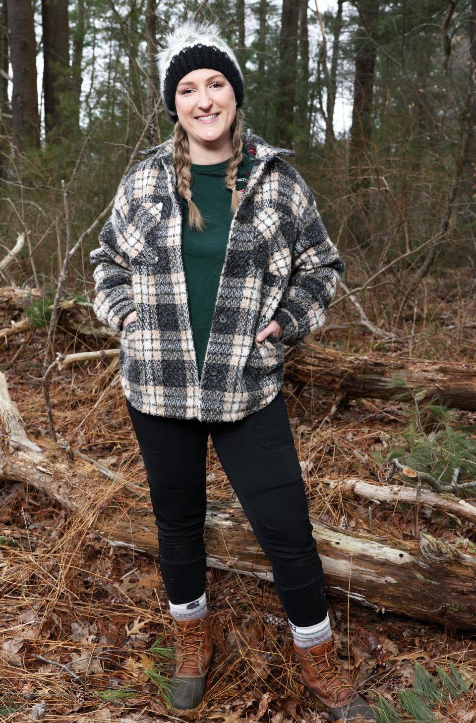 Survivalist Megan Krugger, a local science teacher, at her East Bridgewater farm, Mistletoe Acres Tree Farm, on Saturday, March 9, 2024. She recently appeared on the Discover Channel's "Naked and Afraid."