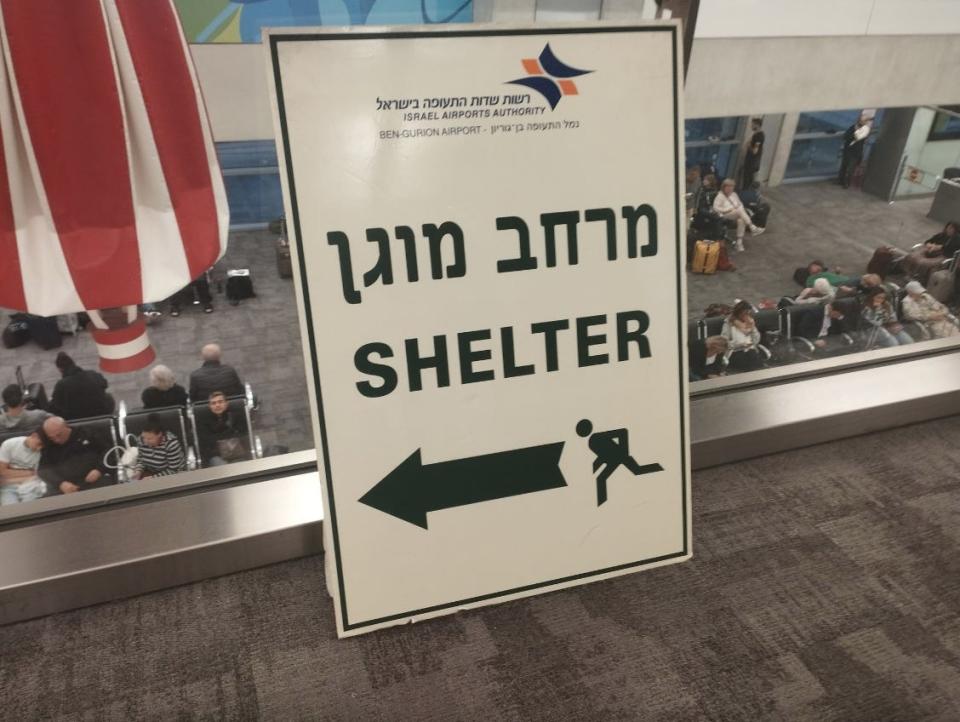 A sign pointing to a bomb shelter inside Israel's Ben Gurion Airport.