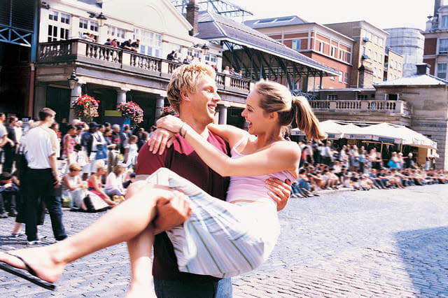 Couple in Covent Garden, London, EnglandCity, Vacations, Travel Destinations, Horizontal, Waist Up, Outdoors, Caucasian Ethnic