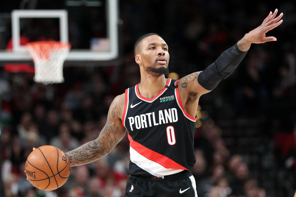 Damian Lillard #0 of the Portland Trail Blazers points down the court against the Golden State Warriors in the first quarter during their game at Moda Center on January 20, 2020 in Portland, Oregon. NOTE TO USER: User expressly acknowledges and agrees that, by downloading and or using this photograph, User is consenting to the terms and conditions of the Getty Images License Agreement (Photo by Abbie Parr/Getty Images)  (Photo by Abbie Parr/Getty Images)