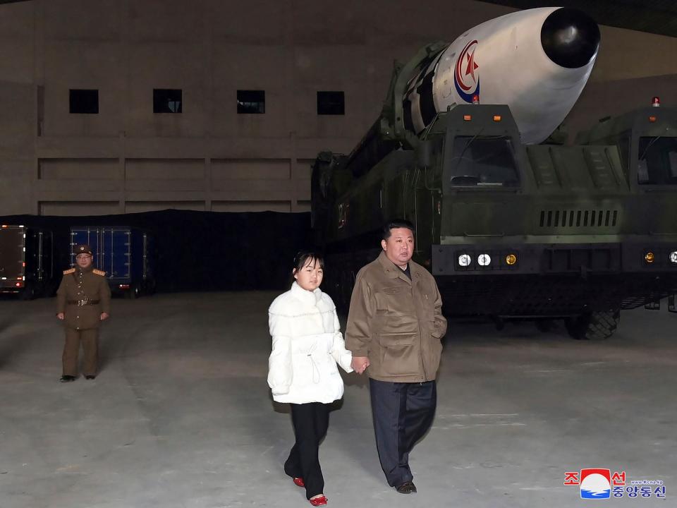 This photo provided on Nov. 19, 2022, by the North Korean government shows North Korean leader Kim Jong Un, right, and his daughter inspects a missile at Pyongyang International Airport in Pyongyang, North Korea, Friday, Nov. 18, 2022.