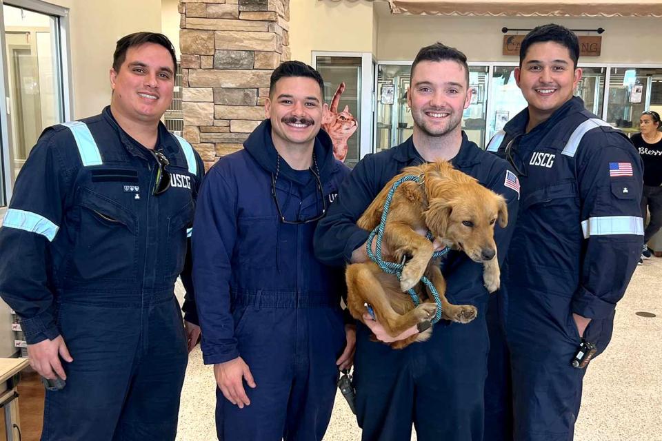 <p>U.S. Coast Guard Heartland/Facebook</p> Connie the dog with the U.S. Coast Guard inspection team that saved her from a shipping container at the Port of Houston