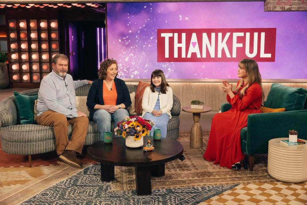 Dean Lange, Jennifer Ghelf and Faith Lange of Norwalk, Iowa, talk with Kelly Clarkson about a fire that destroyed their home during an episode of "The Kelly Clarkson Show" that aired on April 24, 2024.