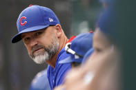 FILE - In this Aug. 12, 2021, file photo, Chicago Cubs manager David Ross watches from the dugout during the eighth inning of a baseball game against the Milwaukee Brewers in Chicago. Ross and president of baseball operations Jed Hoyer have tested positive for COVID-19. (AP Photo/Nam Y. Huh, File)