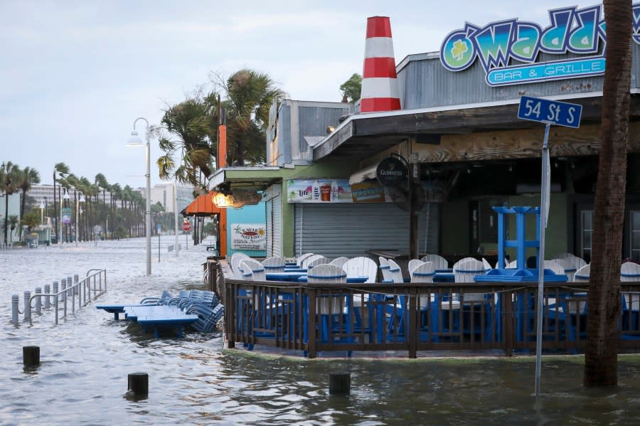 Shore Boulevard in front of O’Maddy’s Bar & Grille is seen in floodwaters as Hurricane Idalia made landfall Wednesday, Aug. 30, 2023, in Gulfport, Fla. (Chris Urso/Tampa Bay Times via AP)