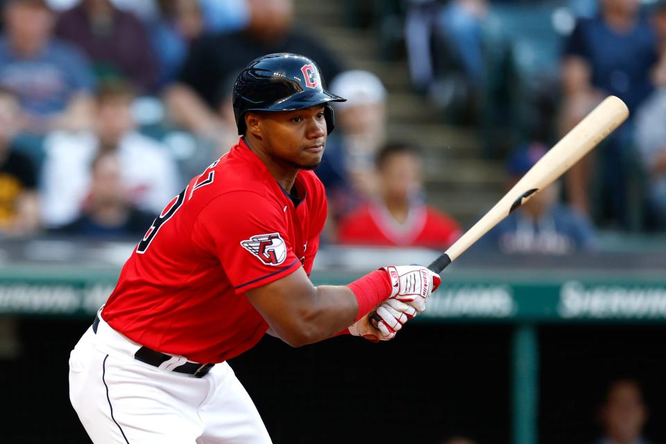 Guardians rookie outfielder Oscar Gonzalez gets one of his four hits during an 8-4 win over the Oakland Athletics on Thursday night at Progressive Field. [Ron Schwane/Associated Press]
