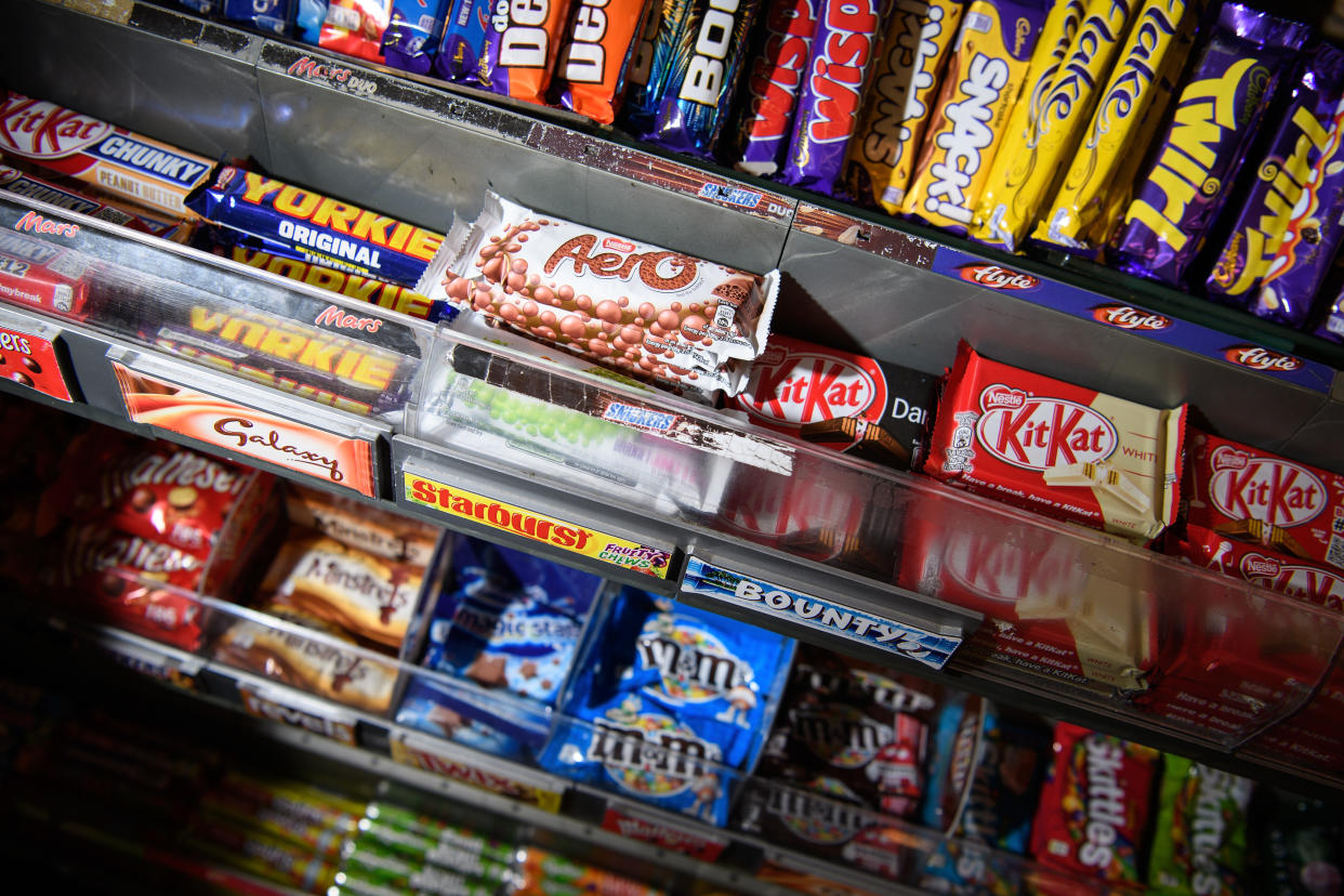 LONDON, ENGLAND - DECEMBER 08:  A selection of confectionary and chocolates are seen on a newsagent shelf on December 8, 2016 in London, England. The Committee on Advertising Practice has announced a ban on online advertisements for food and drinks with a high fat, salt or sugar content.  (Photo by Leon Neal/Getty Images)