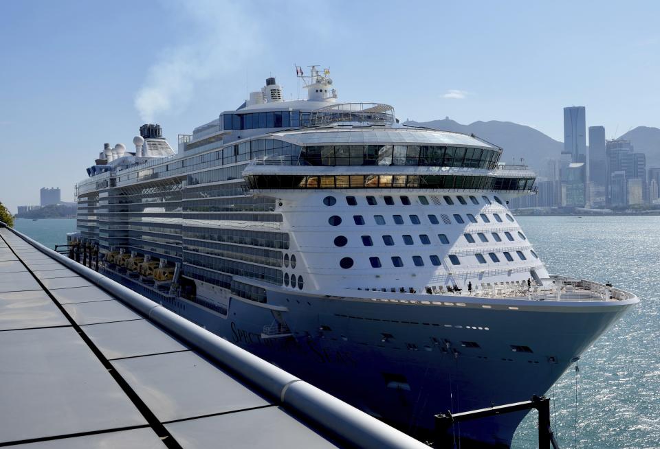 Spectrum of the Seas cruise ship is docked at Kai Tak cruise terminal in Hong Kong Wednesday, Jan. 5, 2022. Thousands of passengers were being held Wednesday on the cruise ship in Hong Kong for coronavirus testing after health authorities said nine passengers were linked to a recent omicron cluster and ordered the ship to turn back. (AP Photo/Vincent Yu)