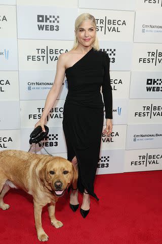 <p>Dia Dipasupil/Getty</p> Selma Blair attends the opening night premiere of 'Diane Von Furstenberg: Woman In Charge' with her service dog Scout on June 05, 2024