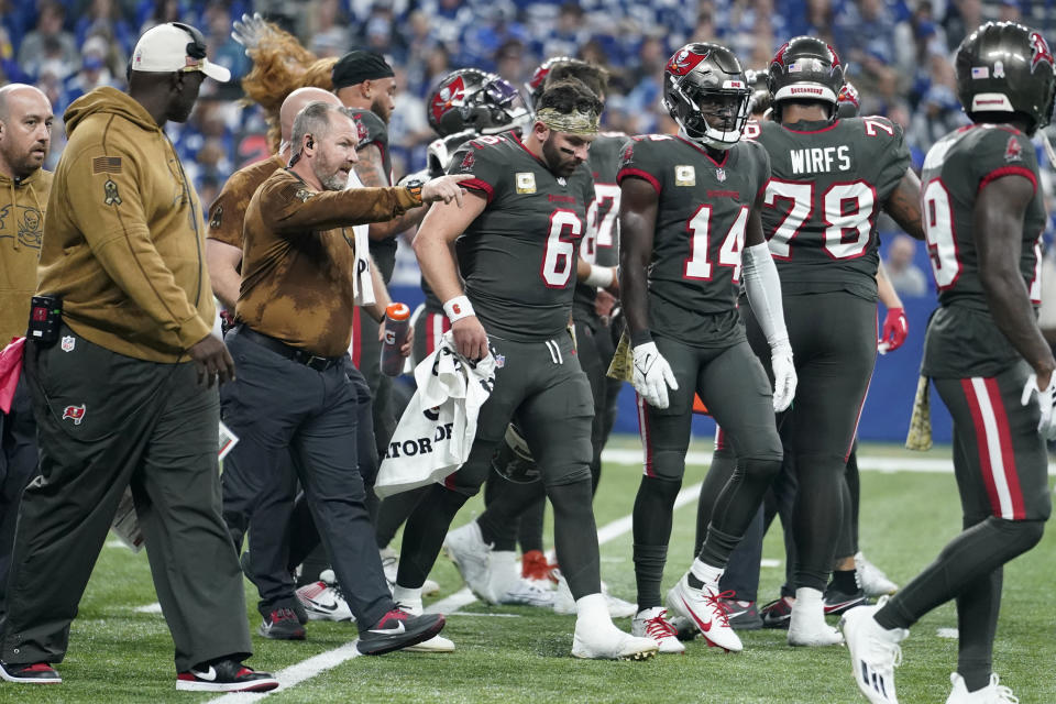 Tampa Bay Buccaneers quarterback Baker Mayfield (6) is helped off the field after being injured during the first half of an NFL football game against the Indianapolis Colts Sunday, Nov. 26, 2023, in Indianapolis. (AP Photo/Michael Conroy)