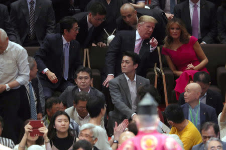 U.S. President Donald Trump, first lady Melania Trump and Japanese Prime Minister Shinzo Abe watch the Summer Grand Sumo Tournament at Ryogoku Kokigikan Sumo Hall in Tokyo, Japan May 26, 2019. REUTERS/Jonathan Ernst