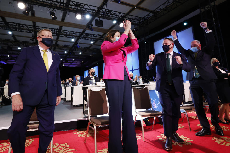 Members of the Brisbane 2032 delegation, from left, John Coates AC, President, Australian Olympic Committee, The Honourable Annastacia Palaszczuk MP, Premier of Queensland and Minister for Trade, and The Right Honourable the Lord Mayor of Brisbane, Councillor Adrian Schrinner, celebrate after Brisbane was announced as the 2032 Summer Olympics host city during the IOC Session at Hotel Okura in Tokyo, Wednesday, July 21, 2021. (Toru Hanai/Pool Photo via AP)