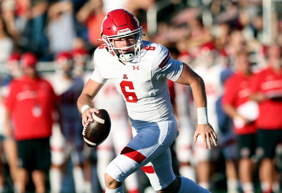 American Fork’s quarterback Dylan Story looks for a receiver as West and American Fork play in Salt Lake City on Friday, Aug. 25, 2023. American Fork won 45-21. | Scott G Winterton, Deseret News