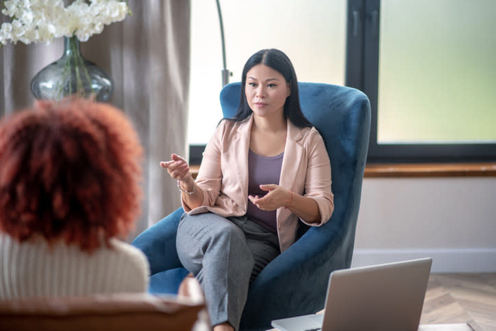 A woman talking to a therapist