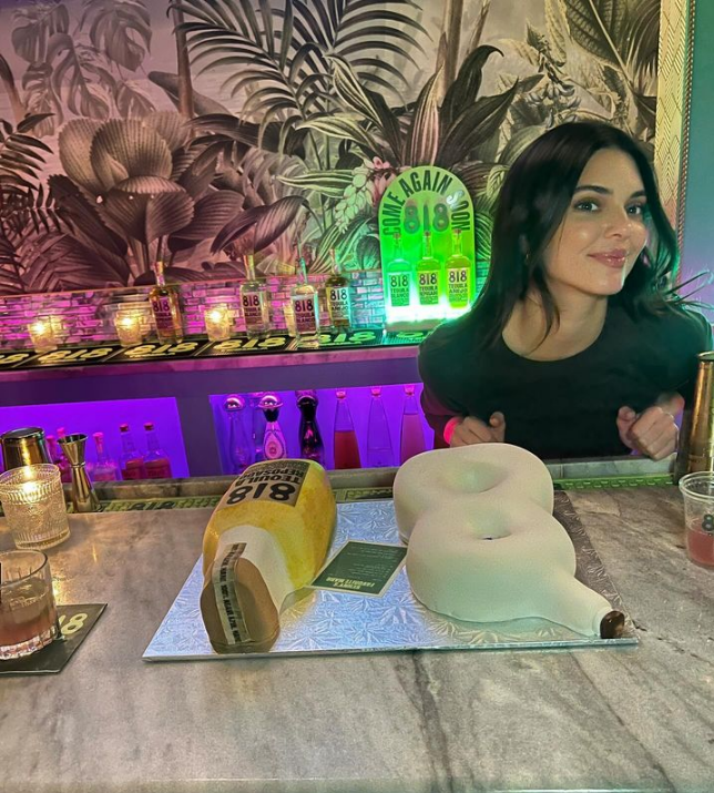 Kendall Jenner poses with specialty cakes at Standard Hall designed to look like her 818 Tequila bottles from A Cake for Leroy, a Columbus-based business.