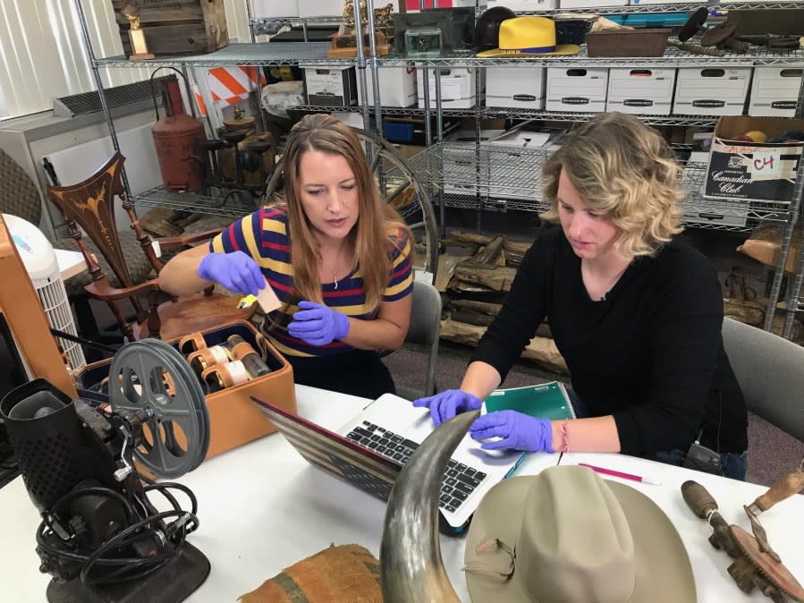 Kassidy Whetstone (on the right), a UNLV student, is part of the team cataloging items from Walking Box Ranch. (KLAS -TV)