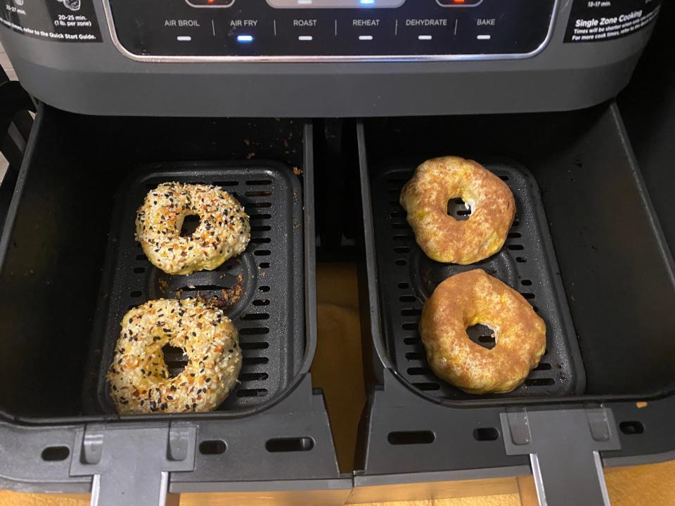 A photo of bagels in an air-fryer basket